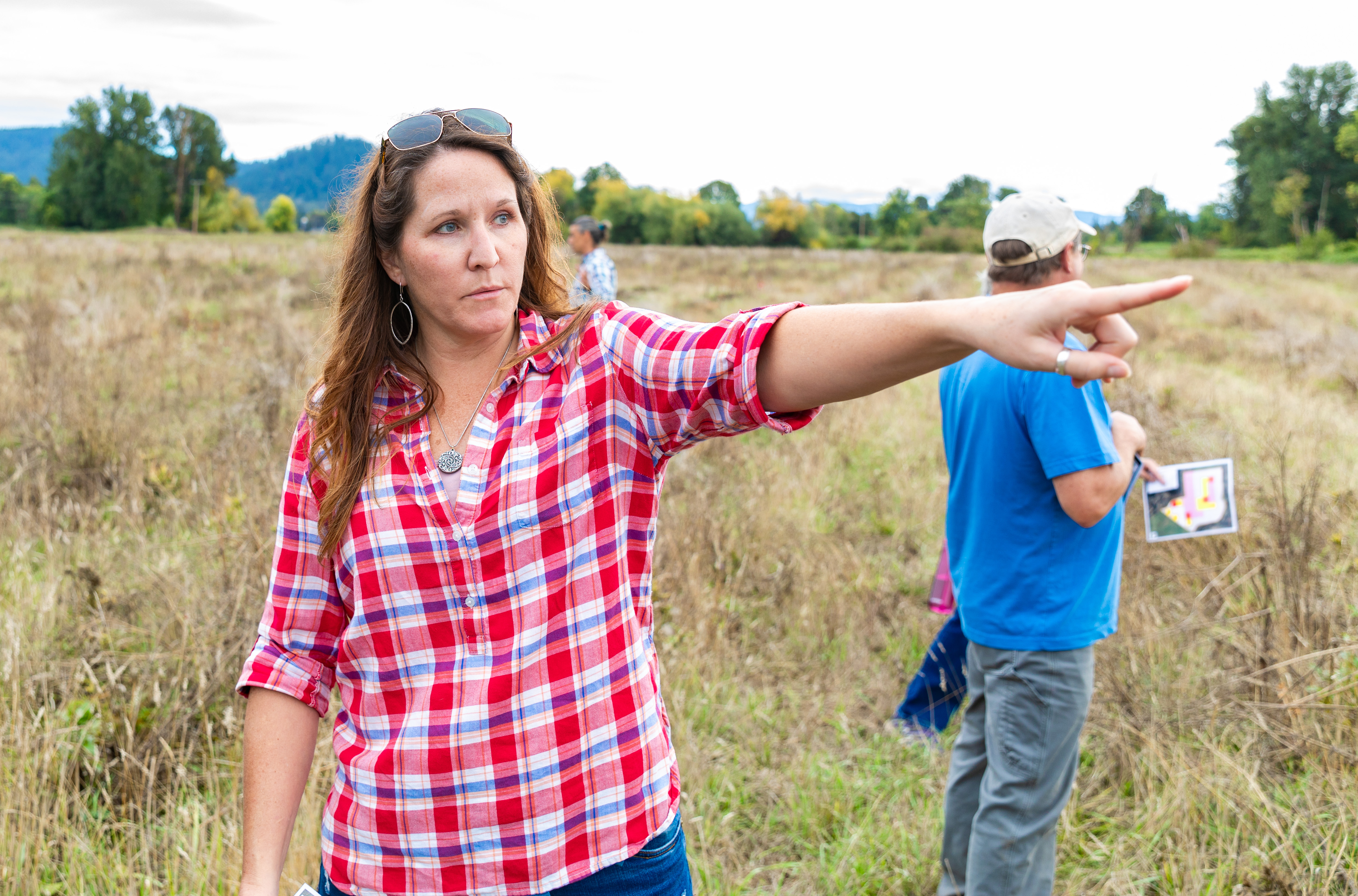 EWEB Business Line Manager Anna Wade points out trees growing at the High Banks experimental carbon forest