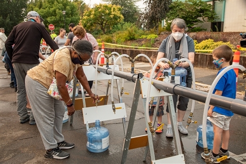 Eugene residents practice using EWEB's Emergency Water Station at Sheldon Community Center