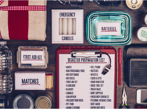 Emergency supplies and checklist laid out on a table