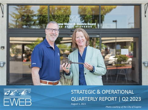 EWEB General Manager Frank Lawson hands over the keys of the Downtown Riverfront Building to Eugene City Manager Sarah Medary