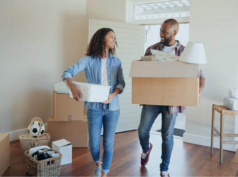 Man with apron in cafe looking at tablet