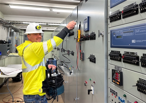 Man tests controls at a substation