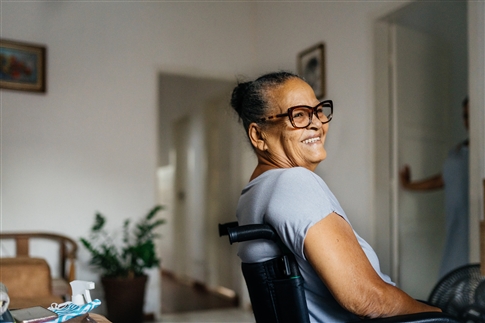 woman smiling in wheelchair