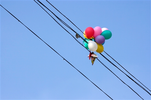 balloon stuck in power lines