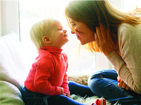 Mom and baby boy playing