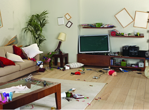 A living room that has suffered earthquake damage