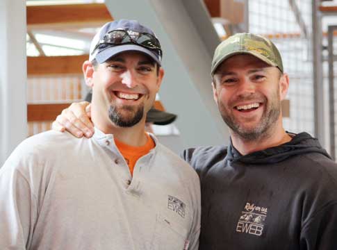 Picture of two EWEB line technicians smiling