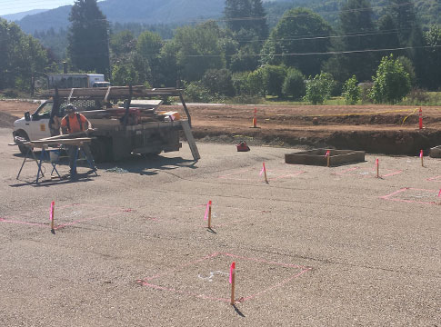 Construction workers build footings for new substation