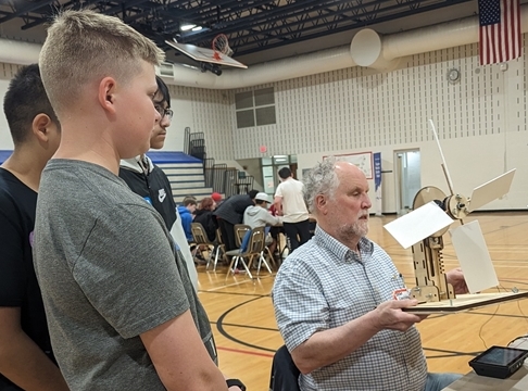 students and teacher in gym