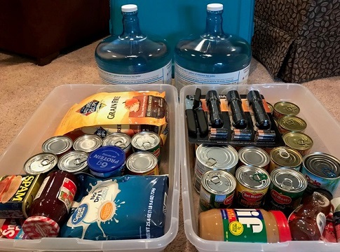 An emergency kit with food, water, flashlights and other supplies