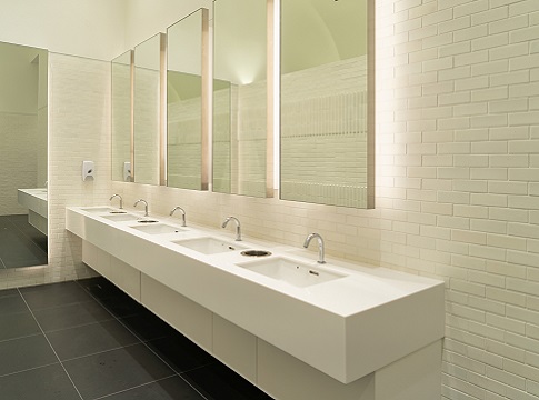 Row of sinks in public restroom