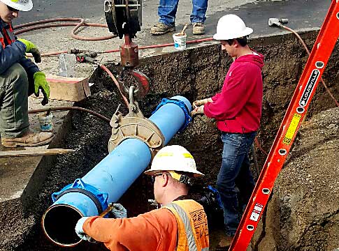 EWEB staff installing a water main