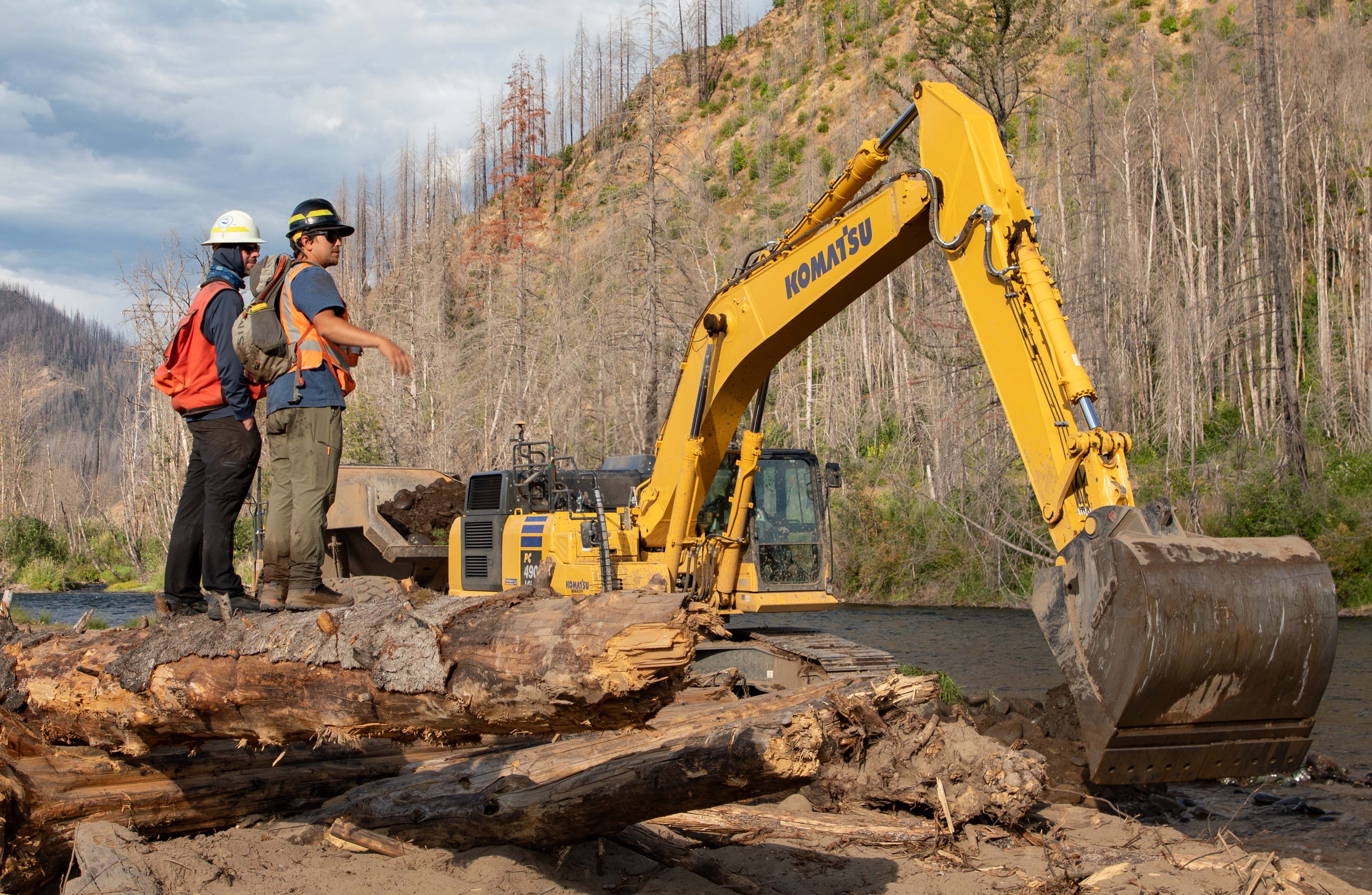 Forest Service fisheries biologists observe the final construction at Finn Rock Reach