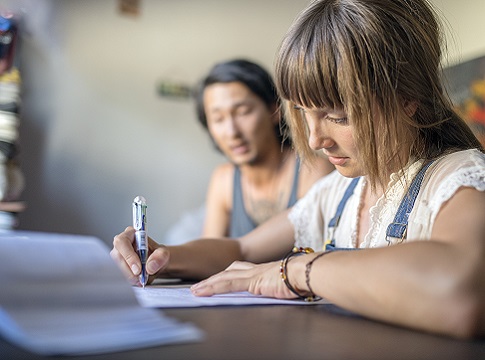 Young couple paying bills