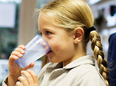 Girl drinking glass of water